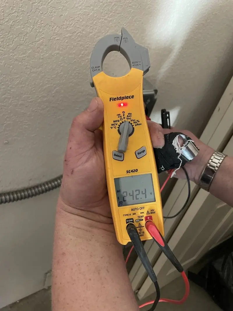 Voltage testing with clamp meter during Whole House Surge Protector in Winnsboro